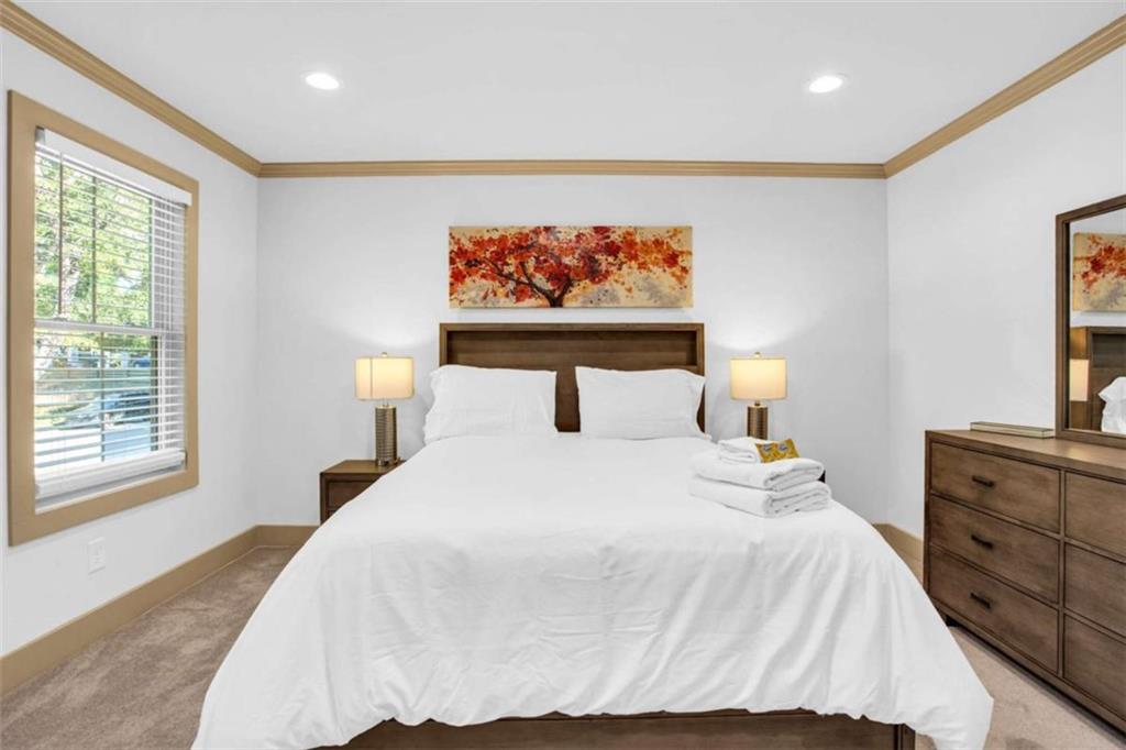 128 Nathan Road Southwest Atlanta, GA 30331 - Photo 31 of 36 a bedroom with a bed and wooden floor