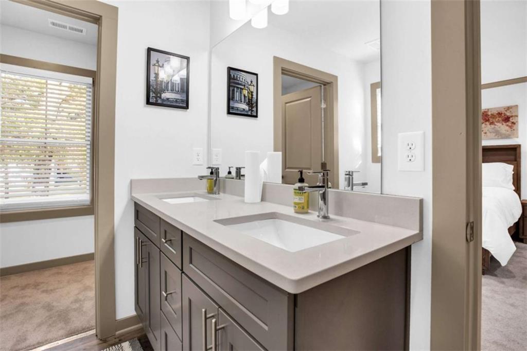 128 Nathan Road Southwest Atlanta, GA 30331 - Photo 33 of 36 a bathroom with a sink and a mirror