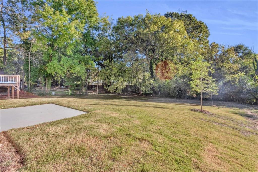 128 Nathan Road Southwest Atlanta, GA 30331 - Photo 35 of 36 a view of a swimming pool with an outdoor space and seating area