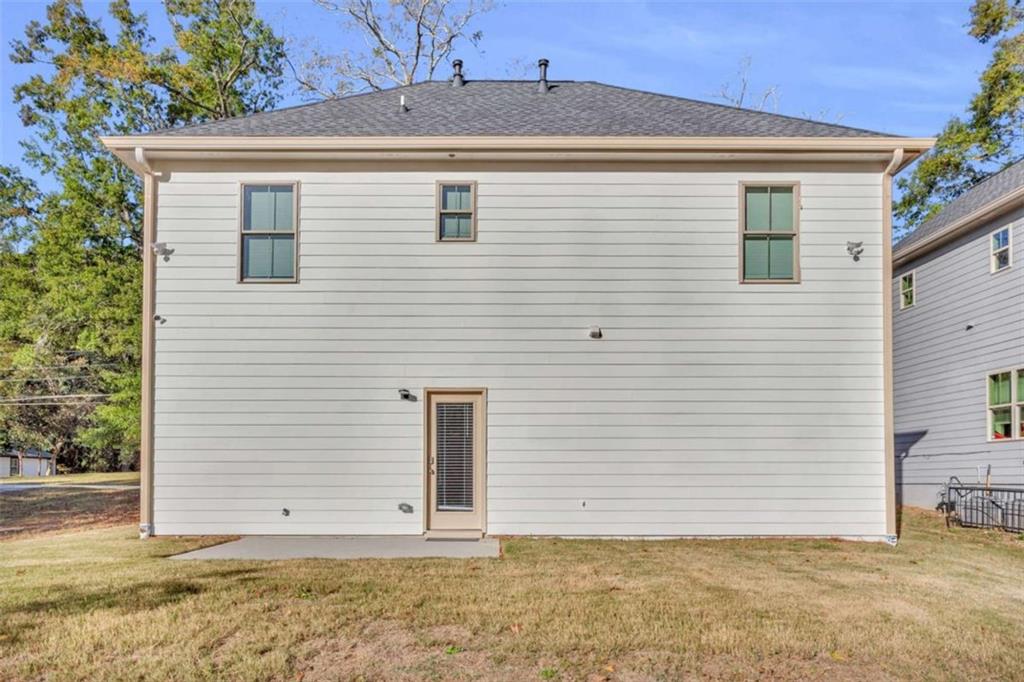 128 Nathan Road Southwest Atlanta, GA 30331 - Photo 36 of 36 a view of a house with a backyard