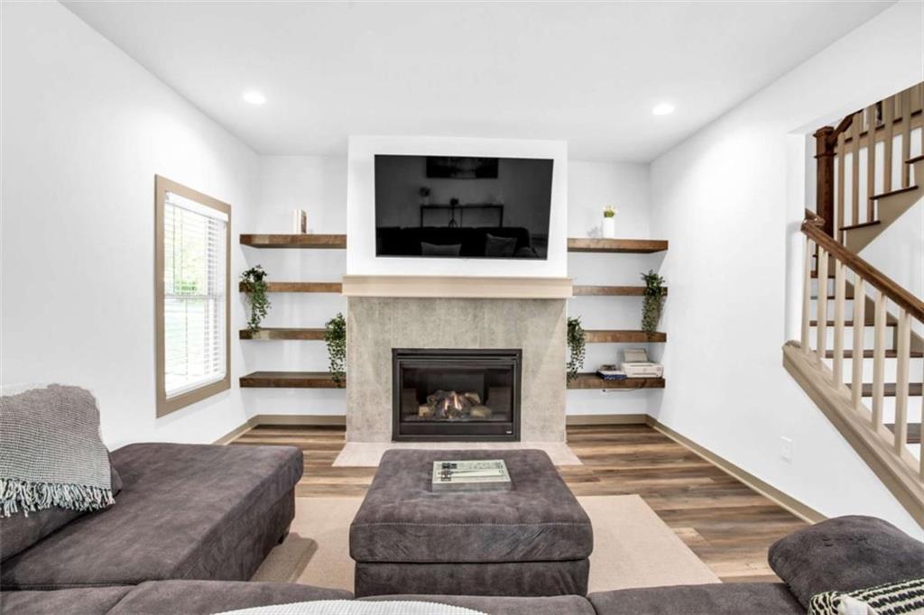 128 Nathan Road Southwest Atlanta, GA 30331 - Photo 8 of 36 a living room with furniture and a fireplace