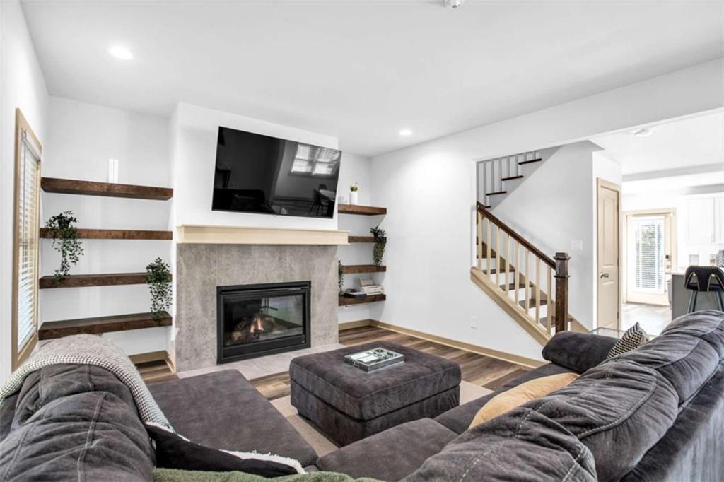 128 Nathan Road Southwest Atlanta, GA 30331 - Photo 9 of 36 a living room with furniture or flat screen tv and a fireplace