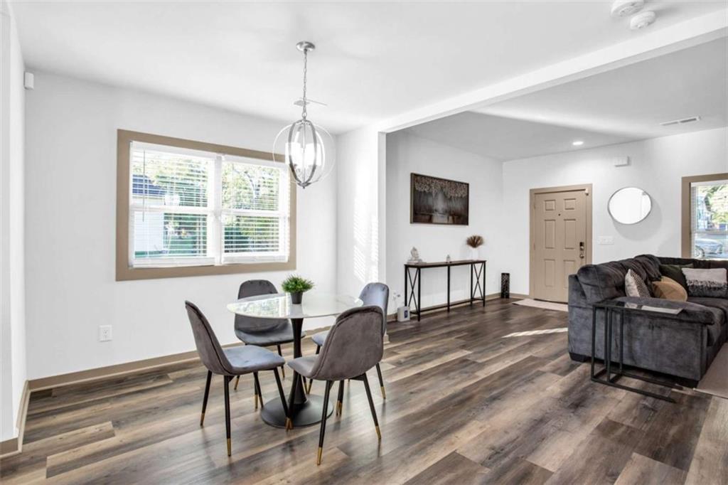128 Nathan Road Southwest Atlanta, GA 30331 - Photo 10 of 36 a living room with furniture and a flat screen tv