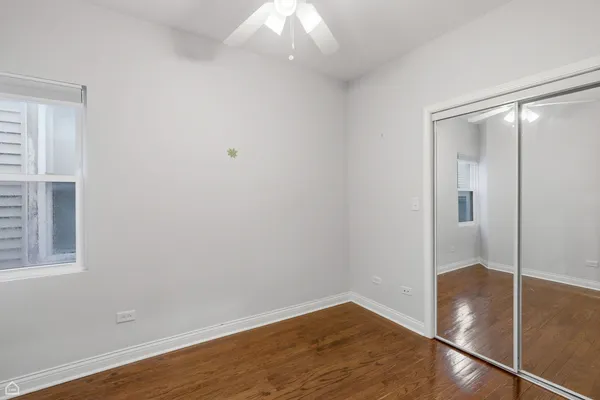 an empty room with wooden floor