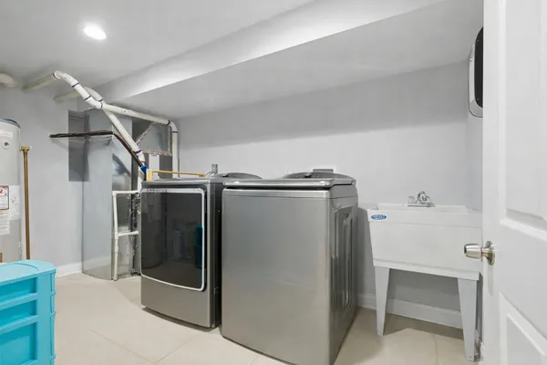 a utility room with washer and dryer