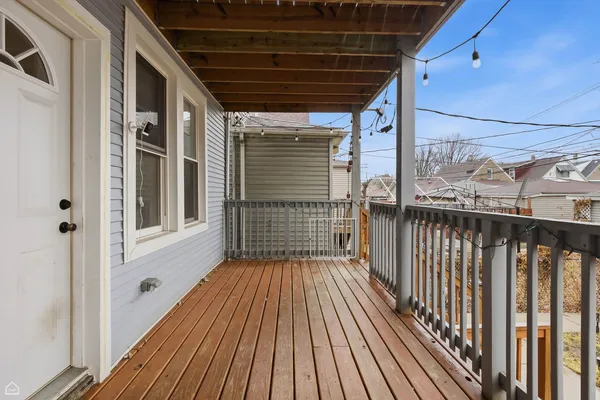a view of a balcony with wooden floor