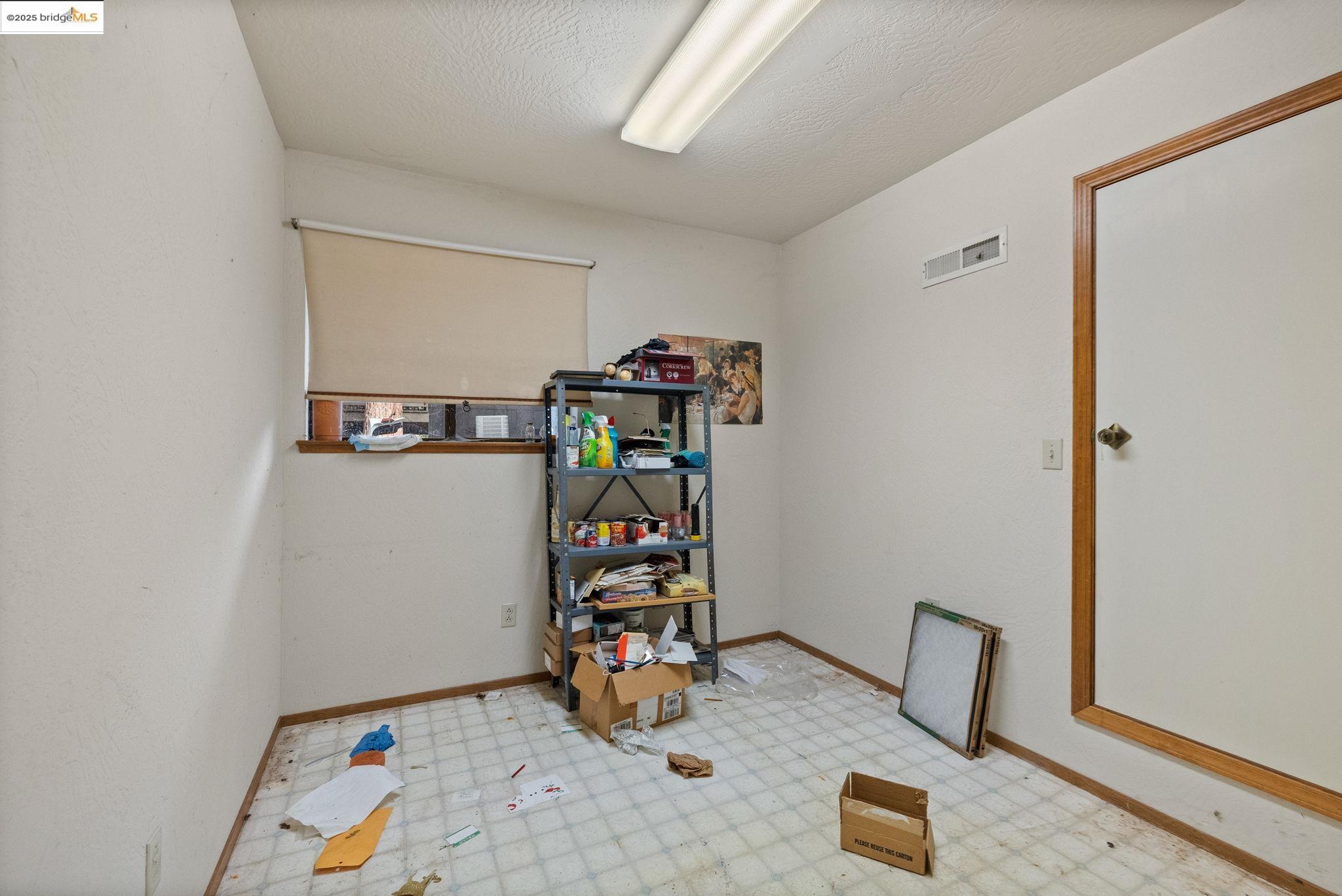 12087 Breckenridge Road Groveland, CA 95321 - Photo 17 of 31 Misc room with light floors and a textured ceiling