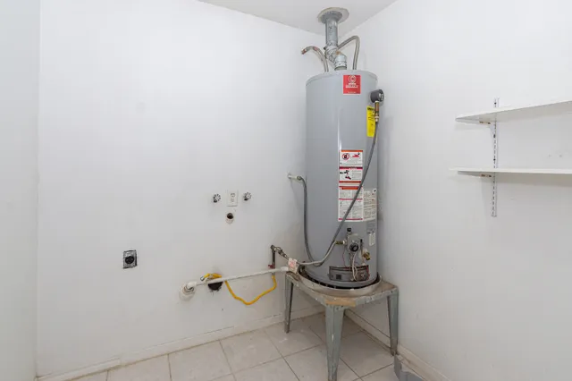 a view of a hallway with washer and dryer