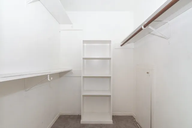 a view of an empty walk in closet