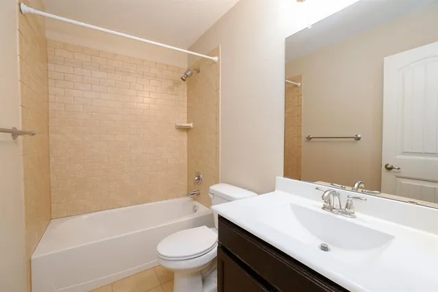 a bathroom with a sink a toilet and a bathtub