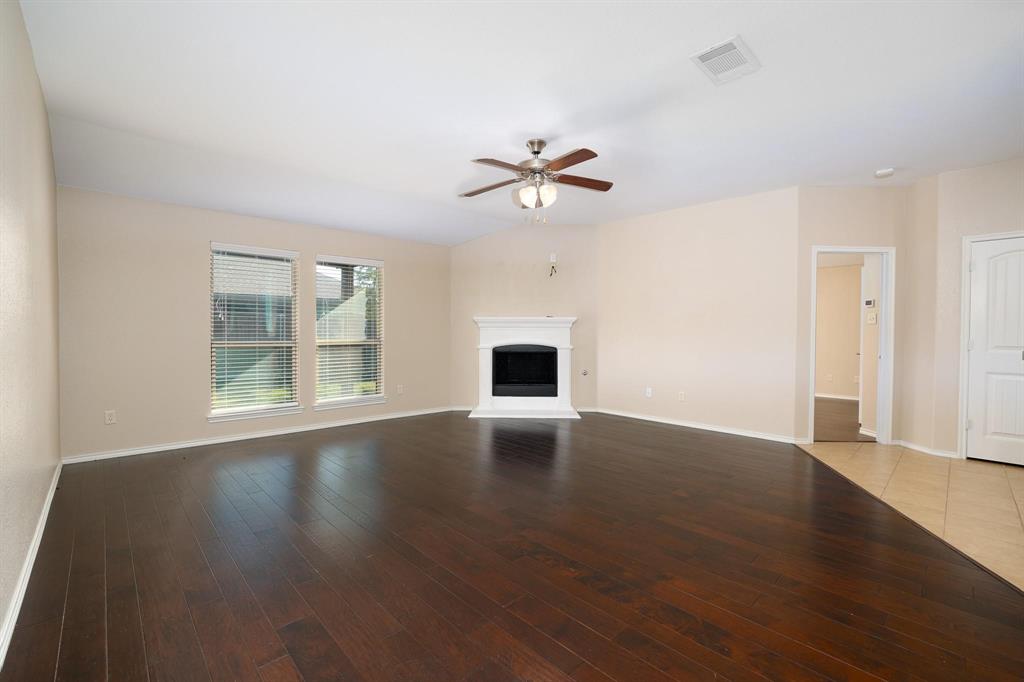1109 Kaufman Road Melissa, TX 75454 - Photo 6 of 22 a view of empty room with wooden floor and fan