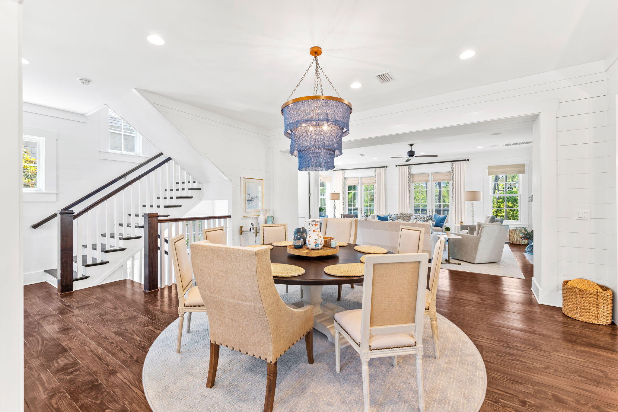 38 Shingle Lane Inlet Beach, FL 32461 - Photo 11 of 94 a dining room with wooden floor a chandelier a wooden table and chairs