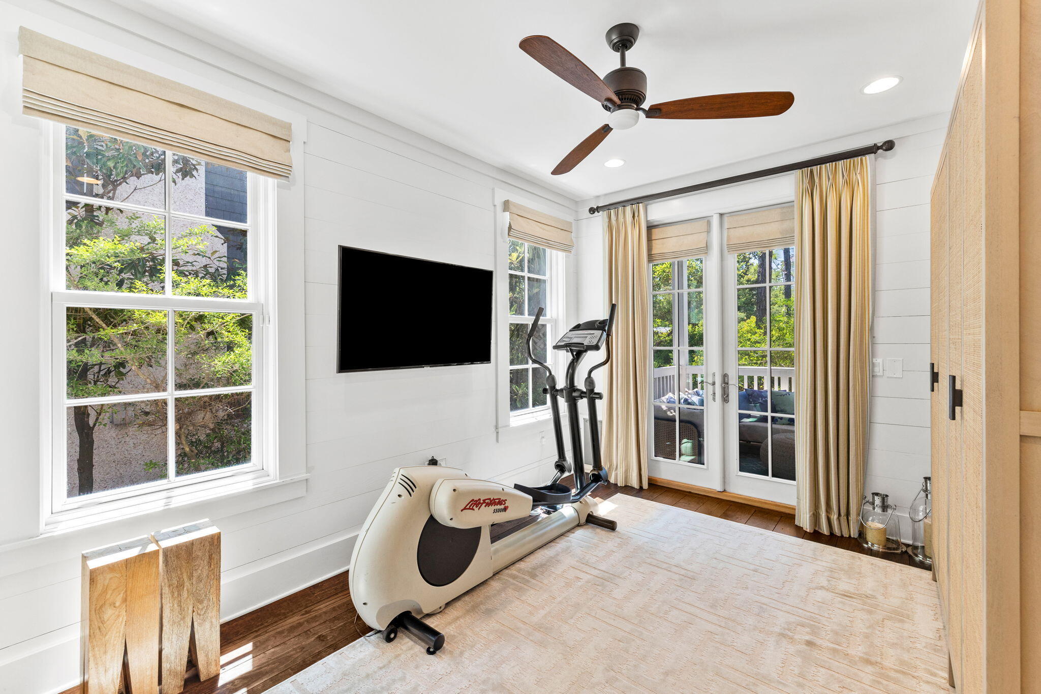 38 Shingle Lane Inlet Beach, FL 32461 - Photo 25 of 94 a living room with furniture a flat screen tv and a floor to ceiling window