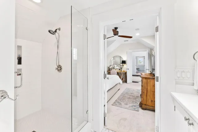 a balcony with furniture and a potted plant