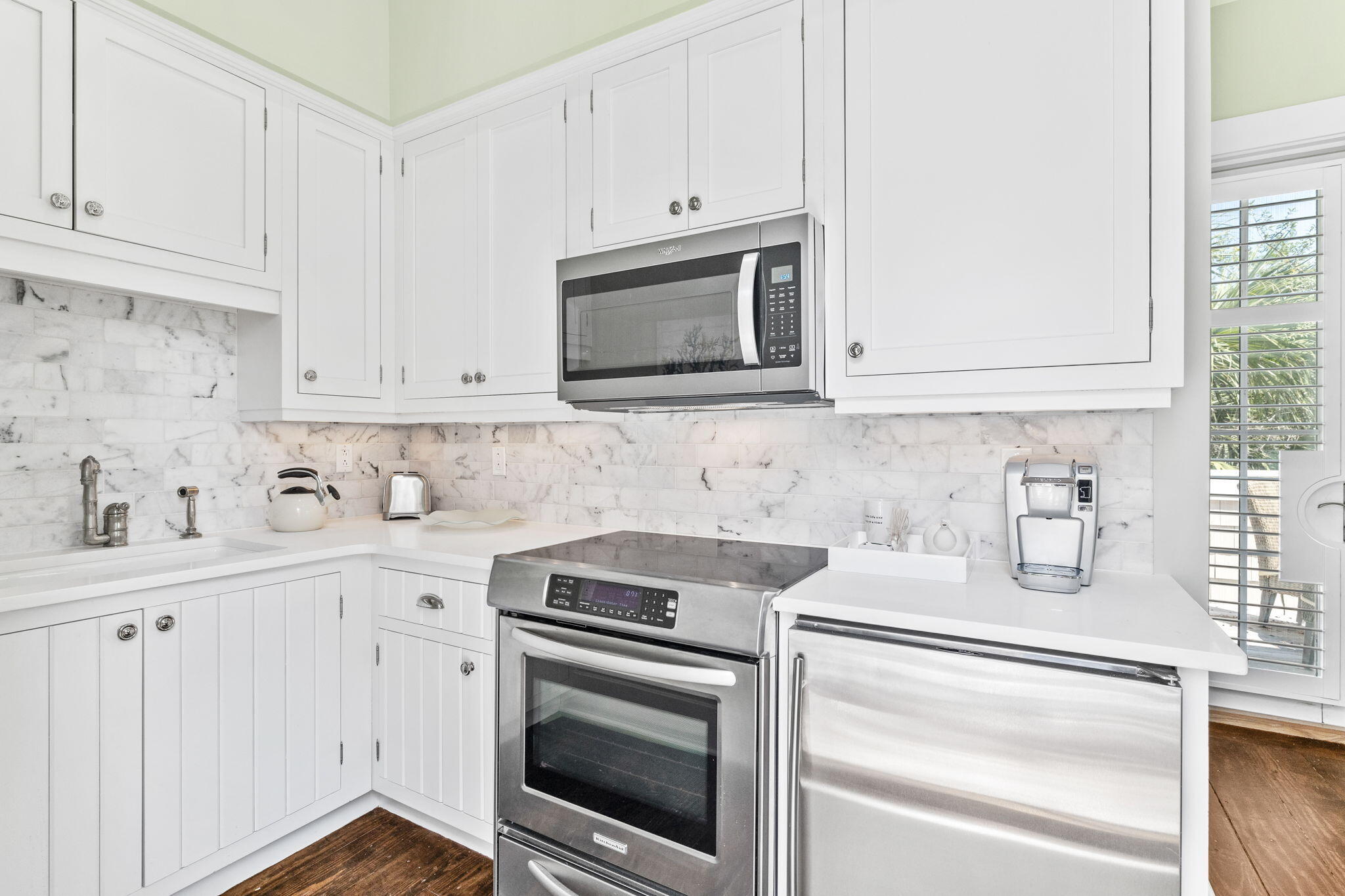 38 Shingle Lane Inlet Beach, FL 32461 - Photo 48 of 94 a kitchen with granite countertop white cabinets and stainless steel appliances