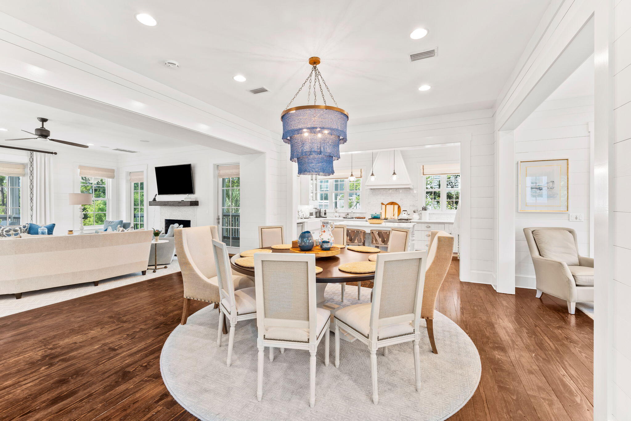 38 Shingle Lane Inlet Beach, FL 32461 - Photo 6 of 94 a dining room with wooden floor a chandelier a glass table and chairs