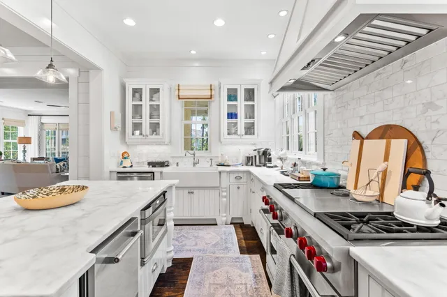 a view of a dining room with furniture wooden floor and chandelier