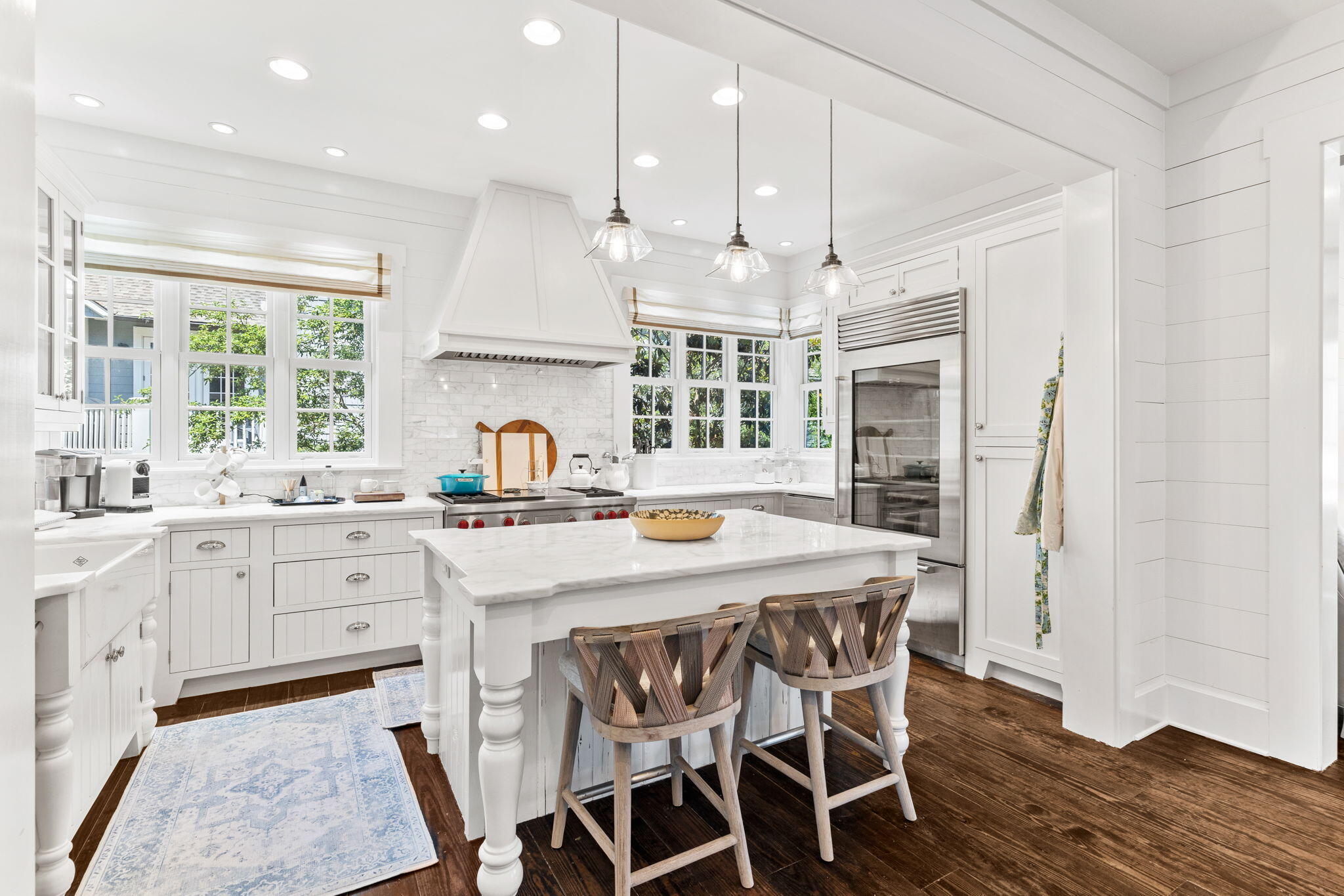 38 Shingle Lane Inlet Beach, FL 32461 - Photo 10 of 94 a kitchen with stainless steel appliances granite countertop a kitchen island a stove a table and chairs in it