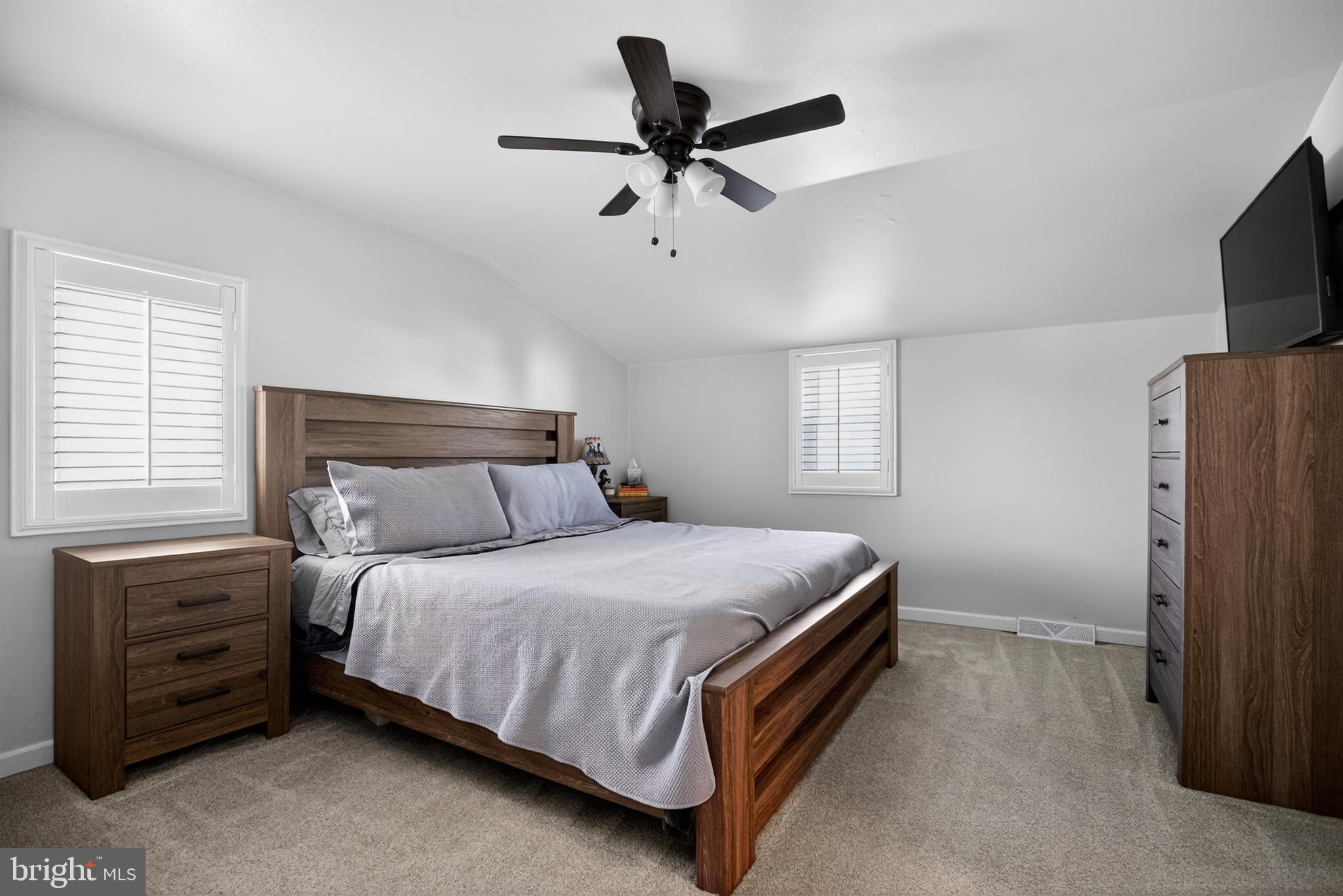 236 Hickory Road Warminster, PA 18974 - Photo 23 of 36 a bedroom with a bed flat screen tv and a window