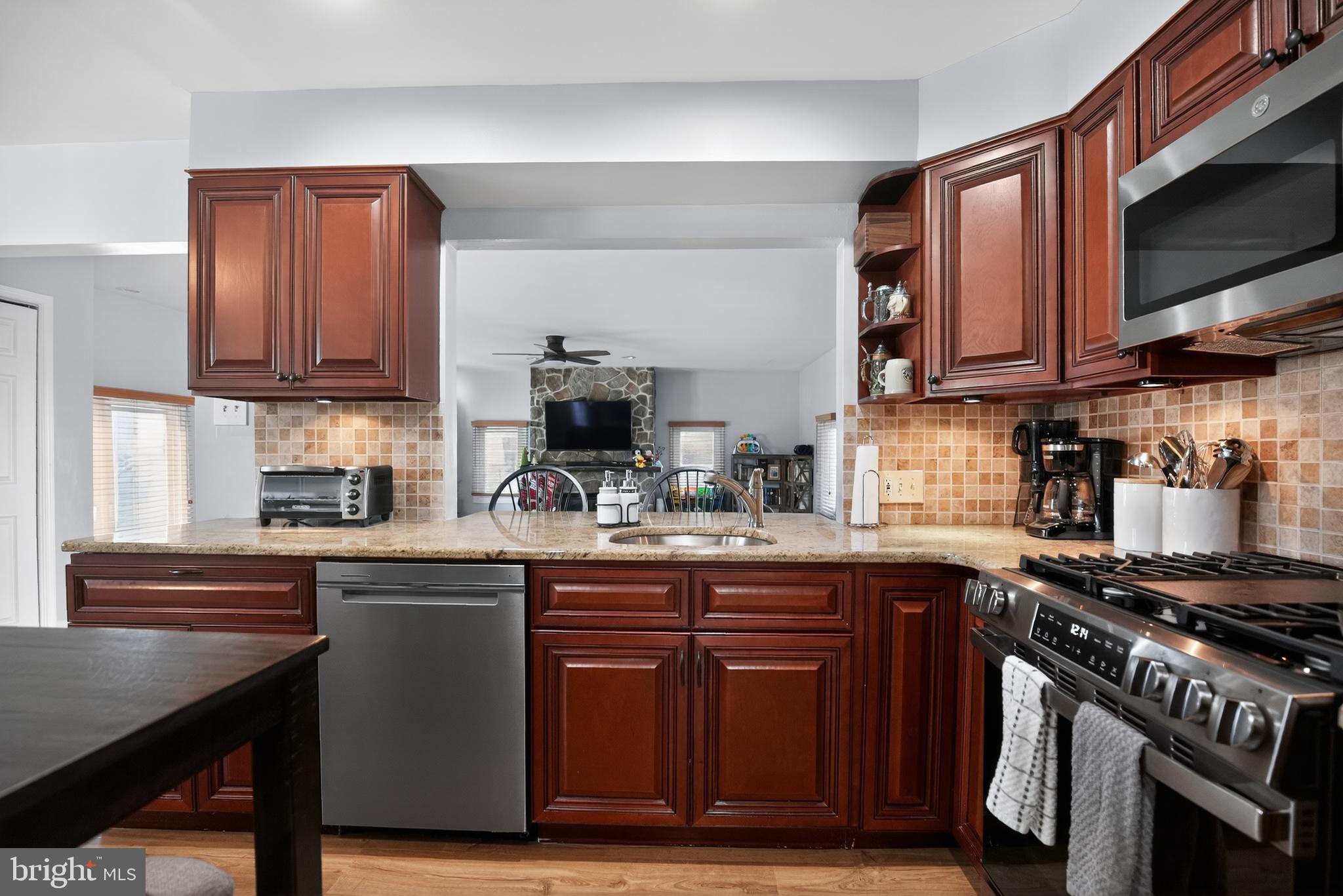 236 Hickory Road Warminster, PA 18974 - Photo 8 of 36 a kitchen with a sink a stove and cabinets