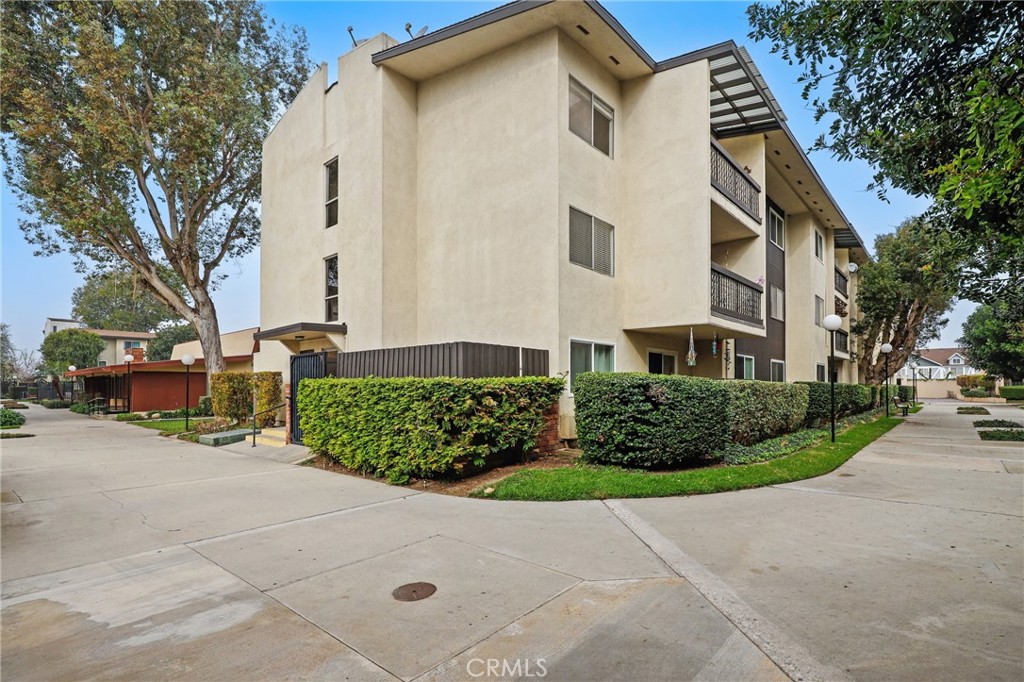 12200 Montecito Road, Unit D301 Seal Beach, CA 90740 - Photo 19 of 28 a view of a white house with a street