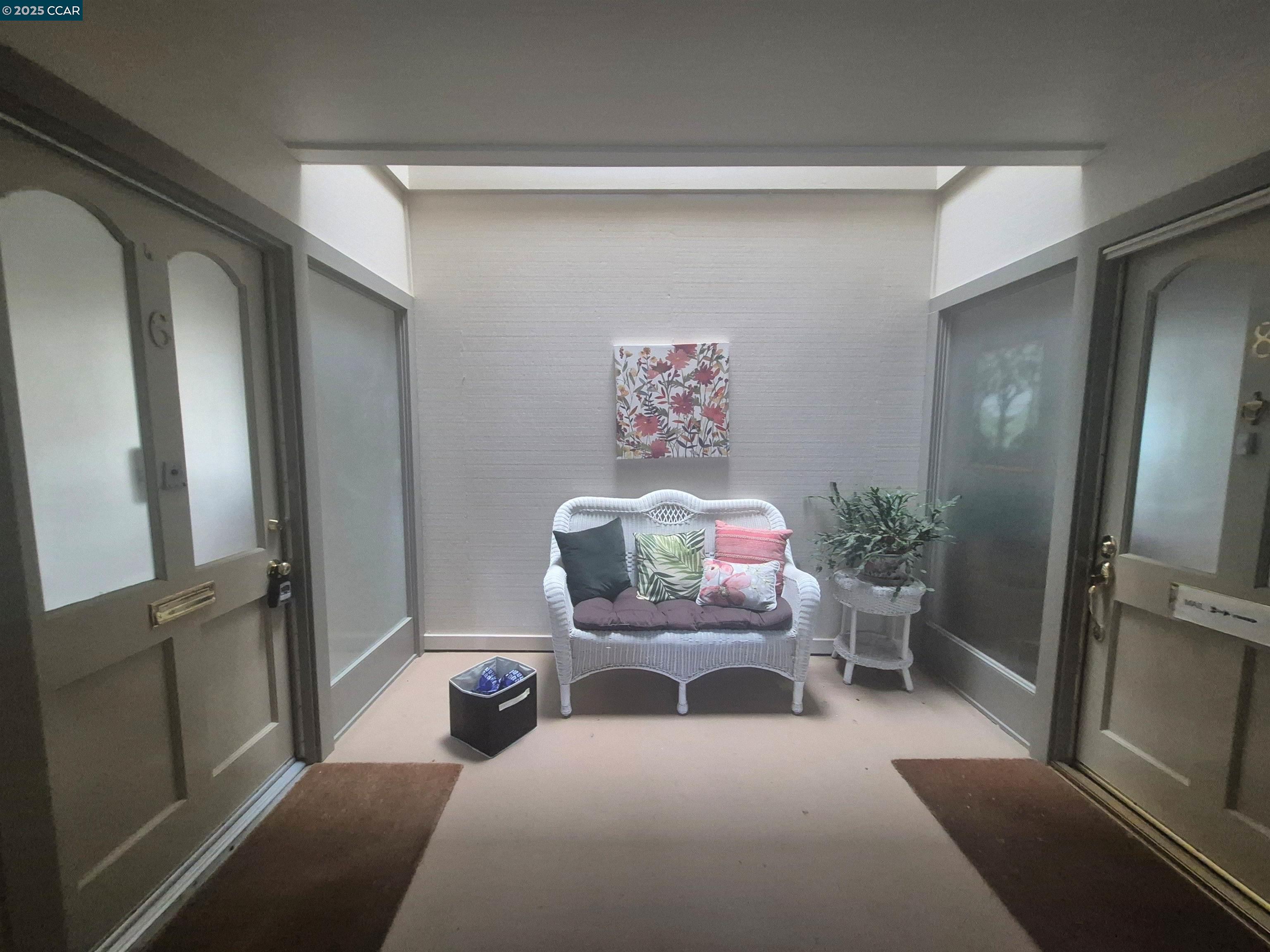 1832 Golden Rain Road, Unit 6 Walnut Creek, CA 94595 - Photo 2 of 36 a living room with furniture and a flat screen tv