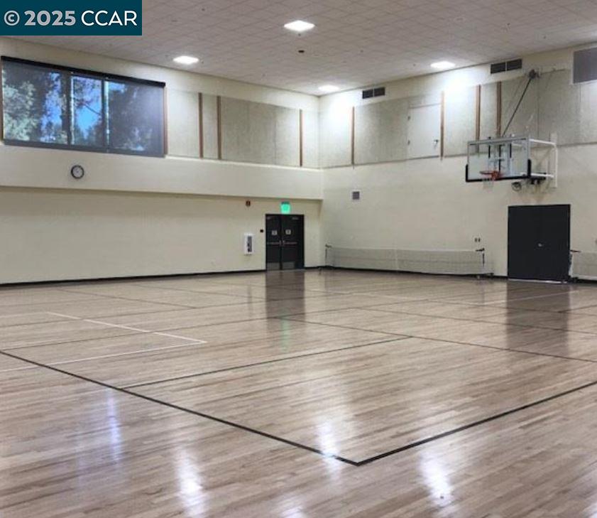 1832 Golden Rain Road, Unit 6 Walnut Creek, CA 94595 - Photo 31 of 36 a view of a kitchen with kitchen island a sink wooden floor and a large window