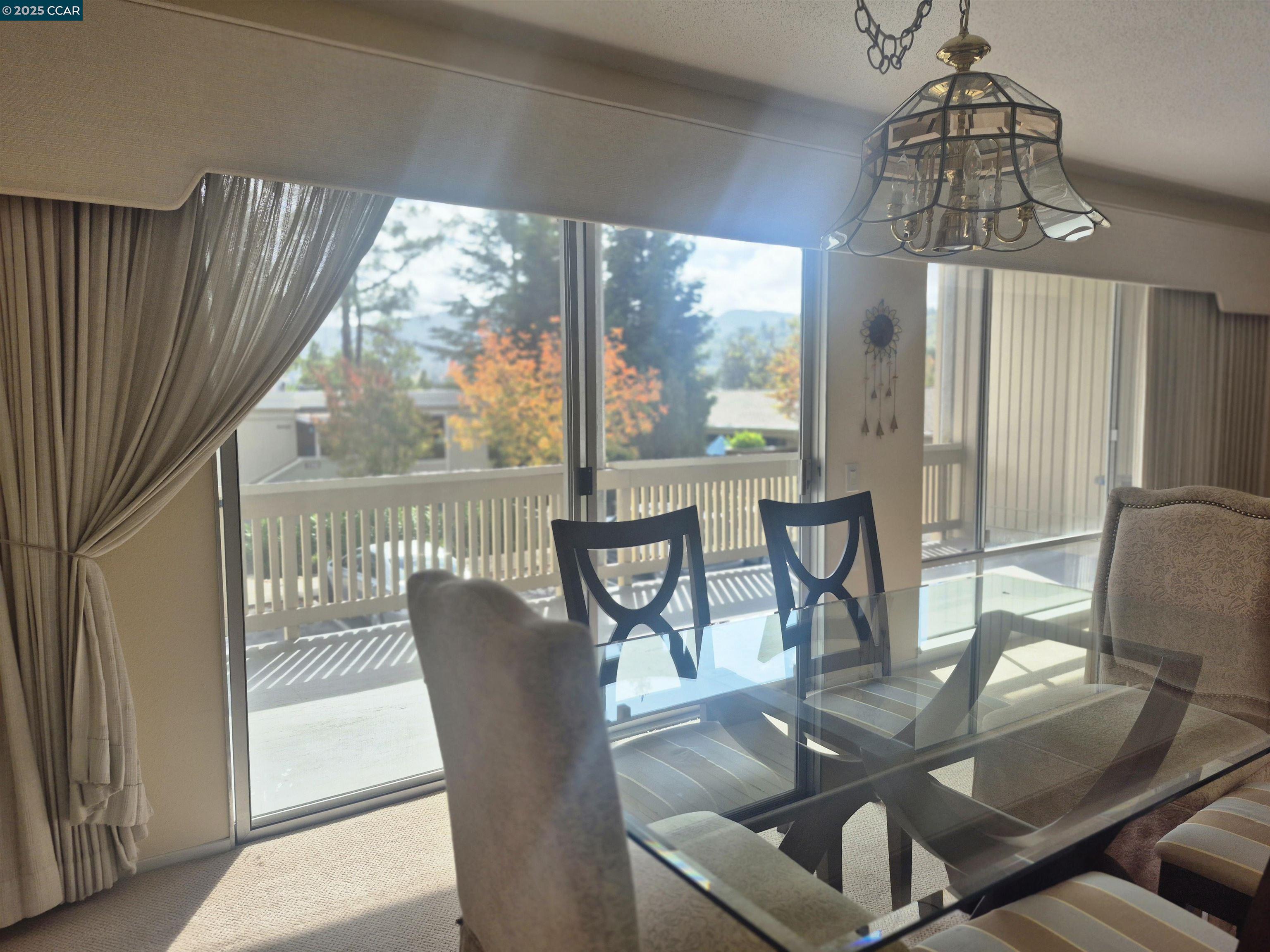 1832 Golden Rain Road, Unit 6 Walnut Creek, CA 94595 - Photo 5 of 36 a view of a dining room with furniture window and outside view