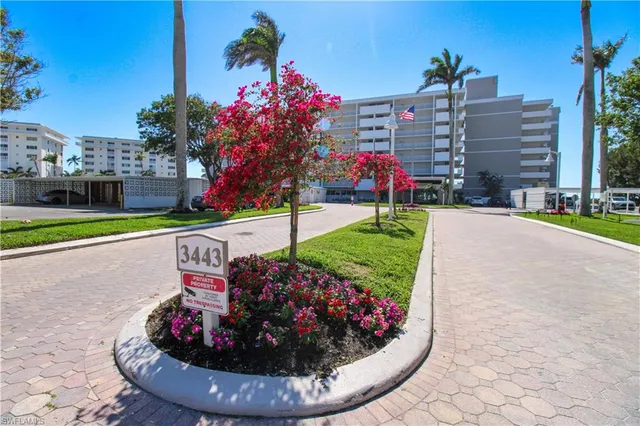 a view of a bird house next to a road