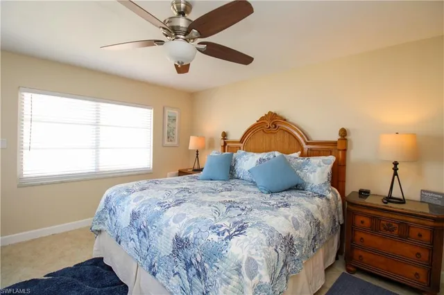 a bedroom with bed and window