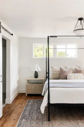 a bedroom with furniture and window
