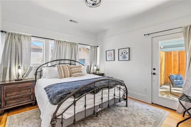 a balcony with furniture and a potted plant