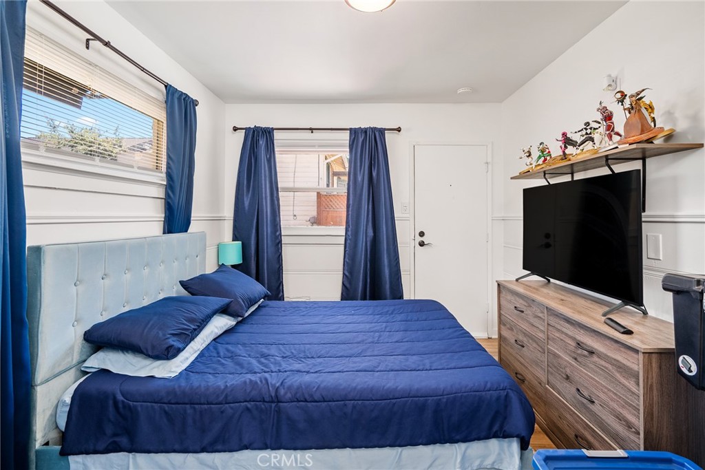 1444 Oak Street Paso Robles, CA 93446 - Photo 32 of 40 a bedroom with a bed and a flat screen tv