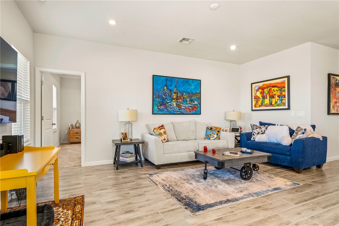 4202 Keeson Circle Vero Beach, FL 32967 - Photo 15 of 36 a living room with furniture and painting on the wall