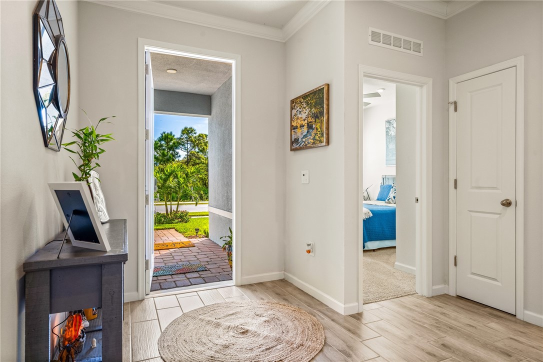 4202 Keeson Circle Vero Beach, FL 32967 - Photo 19 of 36 a view of a bedroom with baby crib and toys