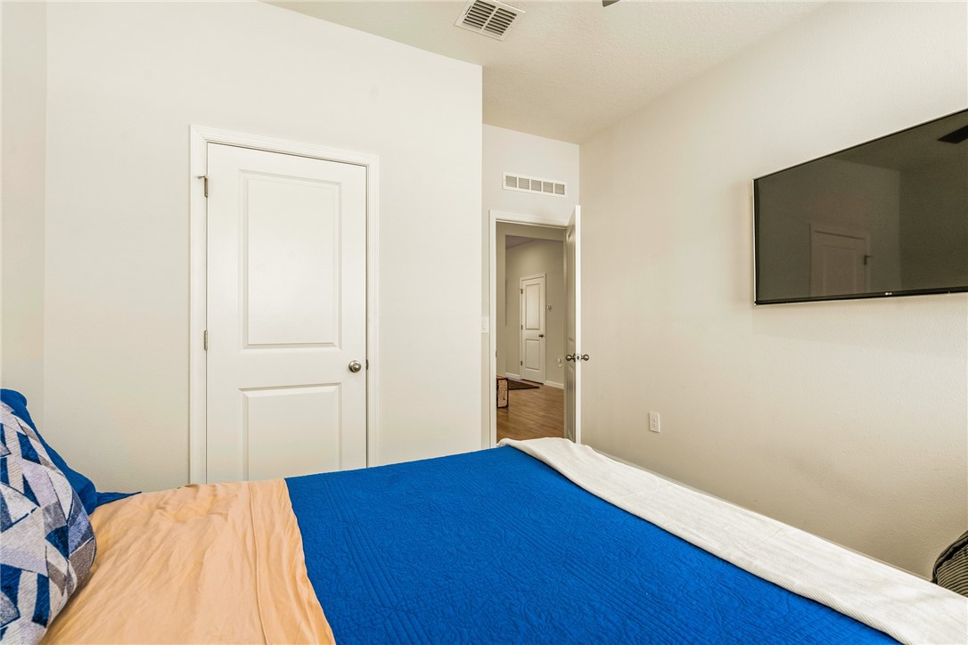 4202 Keeson Circle Vero Beach, FL 32967 - Photo 21 of 36 a view of a bedroom with wooden floor