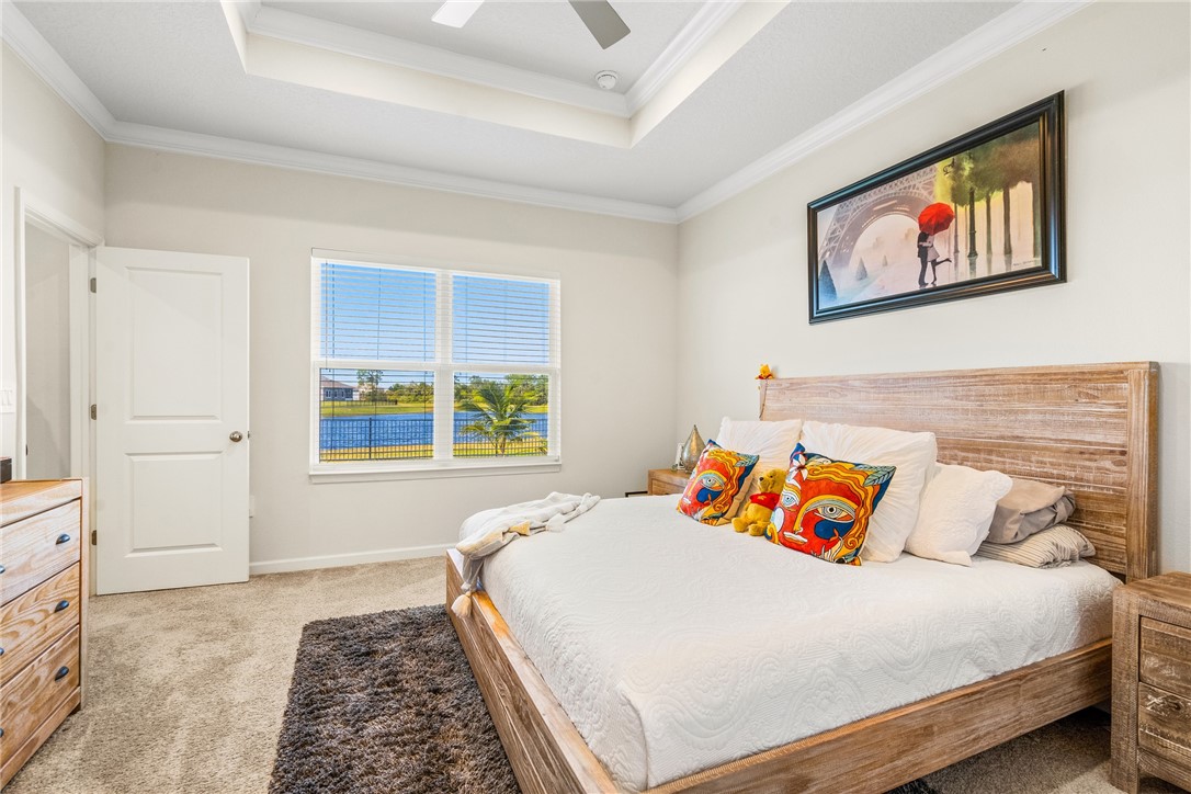 4202 Keeson Circle Vero Beach, FL 32967 - Photo 26 of 36 a bedroom with a bed and a window