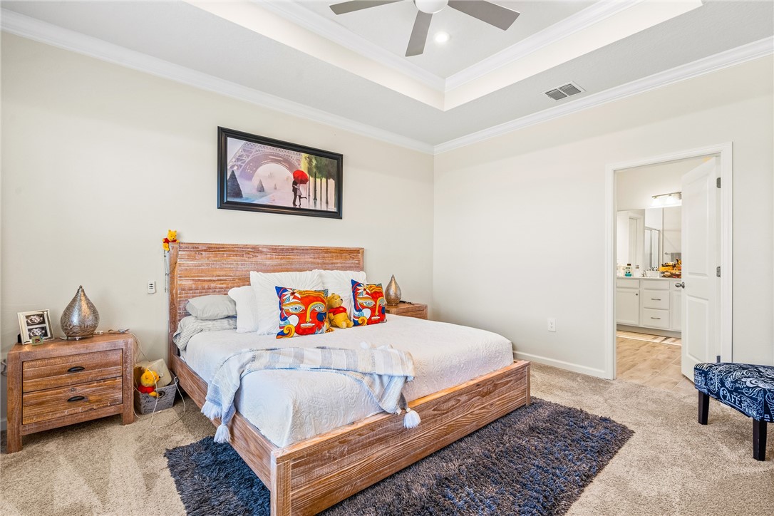 4202 Keeson Circle Vero Beach, FL 32967 - Photo 27 of 36 a bedroom with a bed and wooden floor