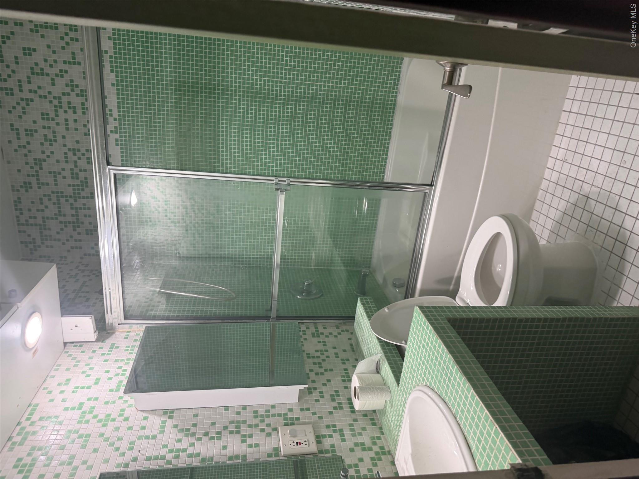 99-32 66th Road, Unit 3AA Queens, NY 11374 - Photo 5 of 9 a bathroom with a sink toilet and shower