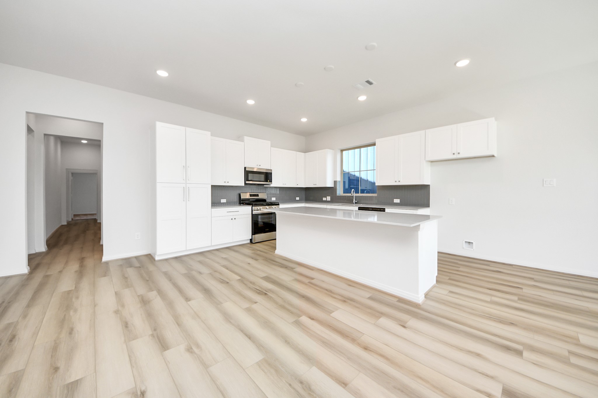 363 Legacy Point, Unit A Sealy, TX 77474 - Photo 15 of 26 a view of kitchen with wooden floor