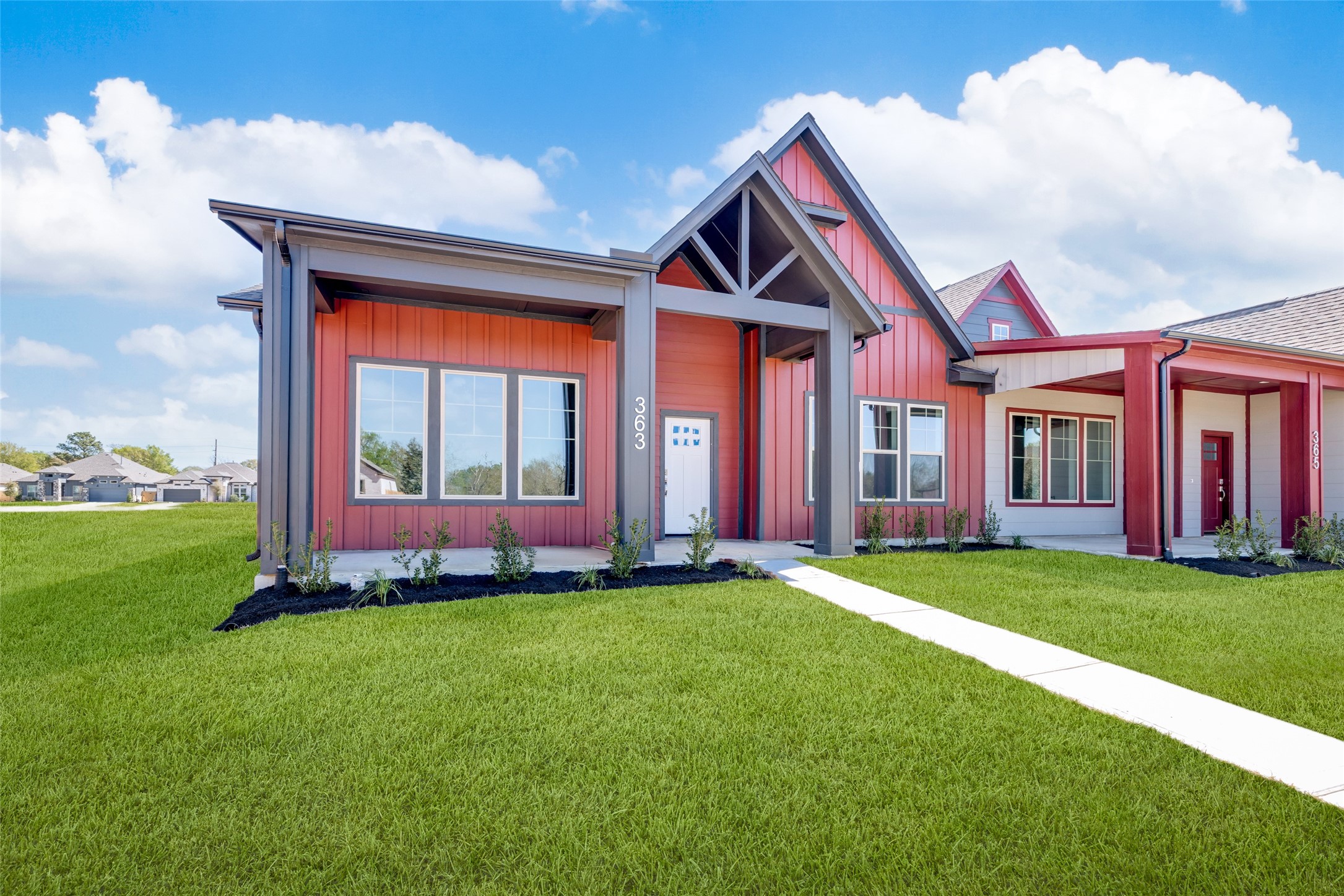 363 Legacy Point, Unit A Sealy, TX 77474 - Photo 2 of 26 a front view of a house with a yard