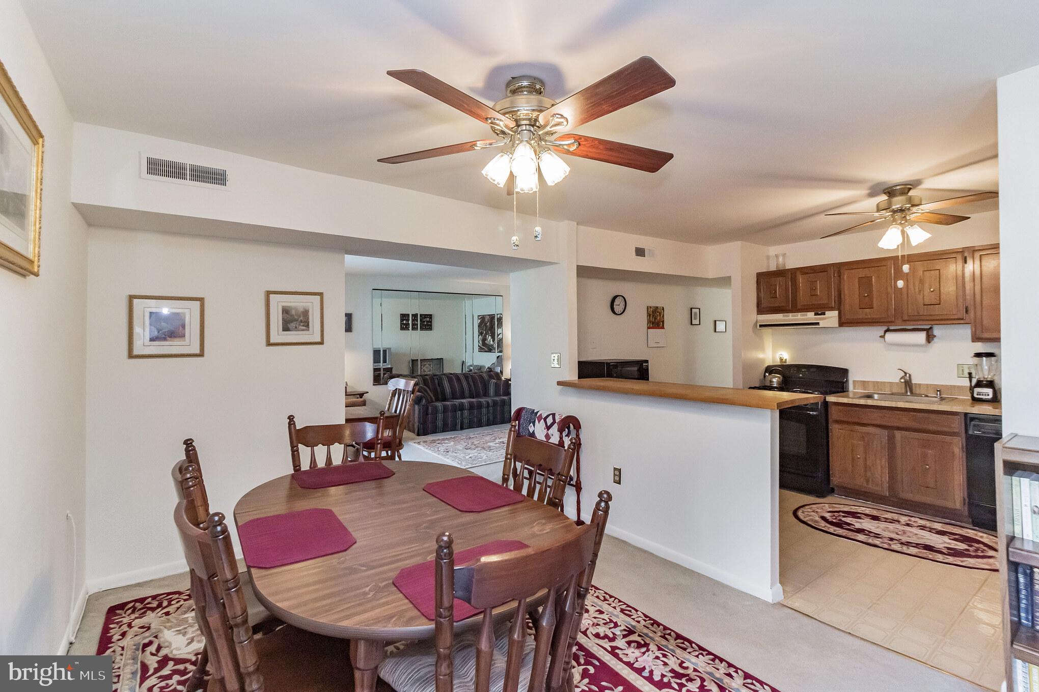 8679 Greenbelt Road, Unit 201 Greenbelt, MD 20770 - Photo 7 of 18 Dining room opens to Kitchen