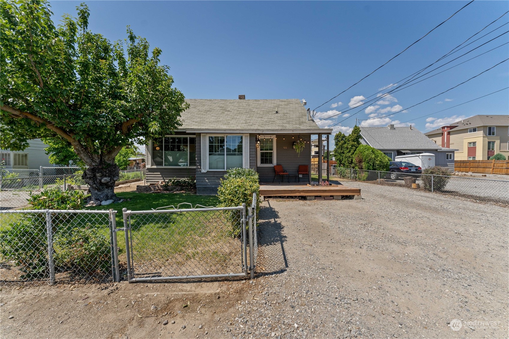 100 East Island View Street Wenatchee, WA 98801 - Photo 6 of 40 a view of a house with backyard sitting area and garden
