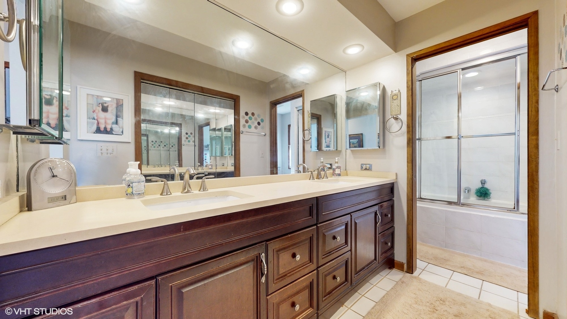 1925 Maple Place Riverwoods, IL 60015 - Photo 23 of 59 a bathroom with a double vanity sink and a mirror