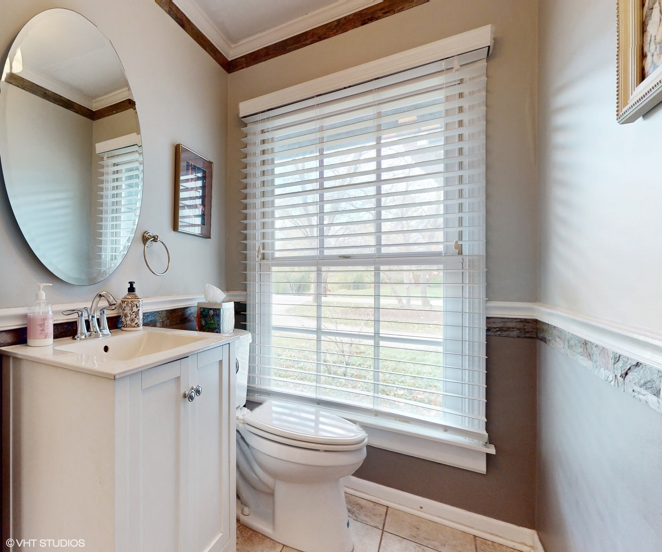 1925 Maple Place Riverwoods, IL 60015 - Photo 31 of 59 a bathroom with a toilet a sink a mirror and a window