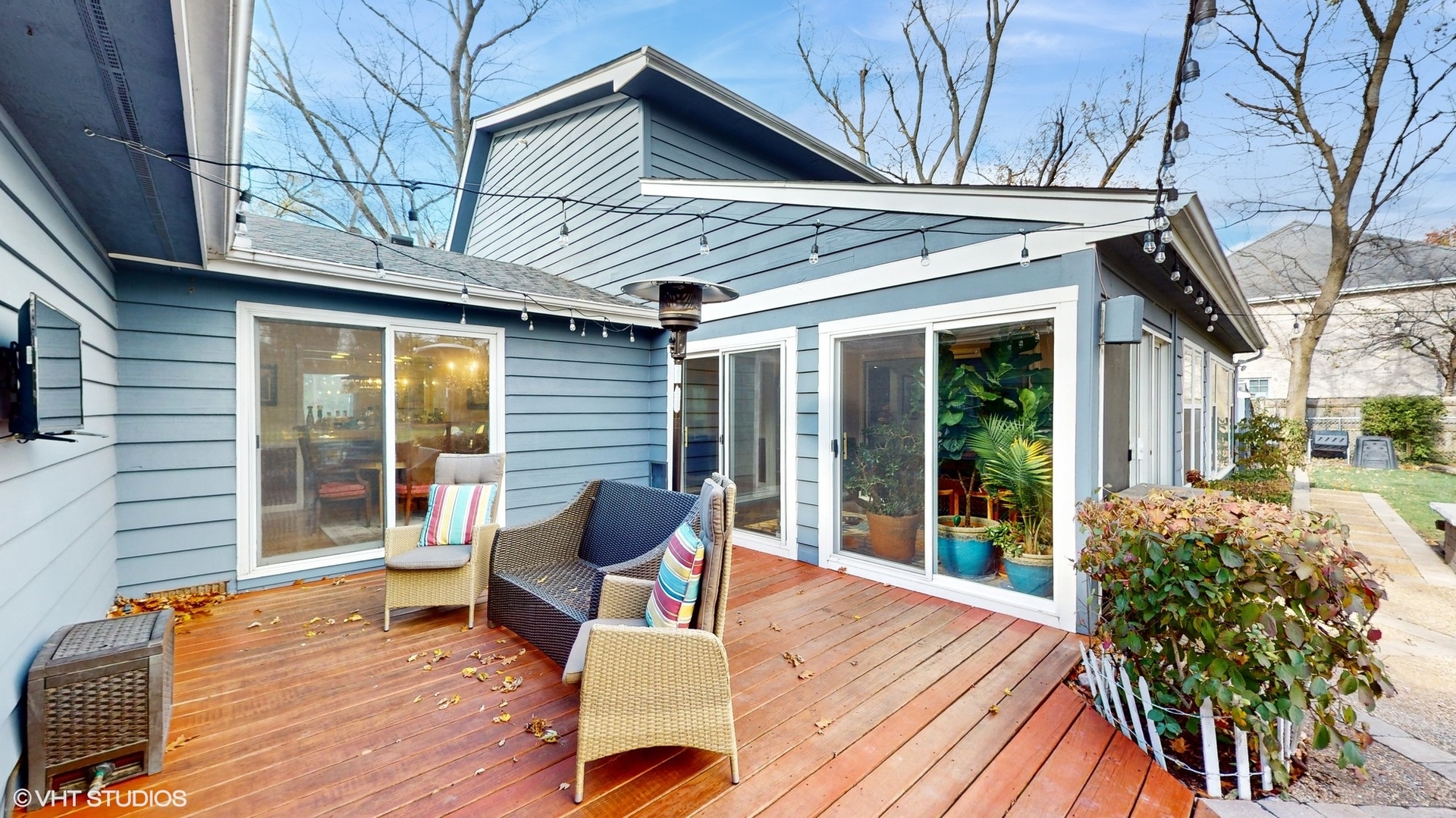 1925 Maple Place Riverwoods, IL 60015 - Photo 45 of 59 a view of a patio with table and chairs and wooden floor