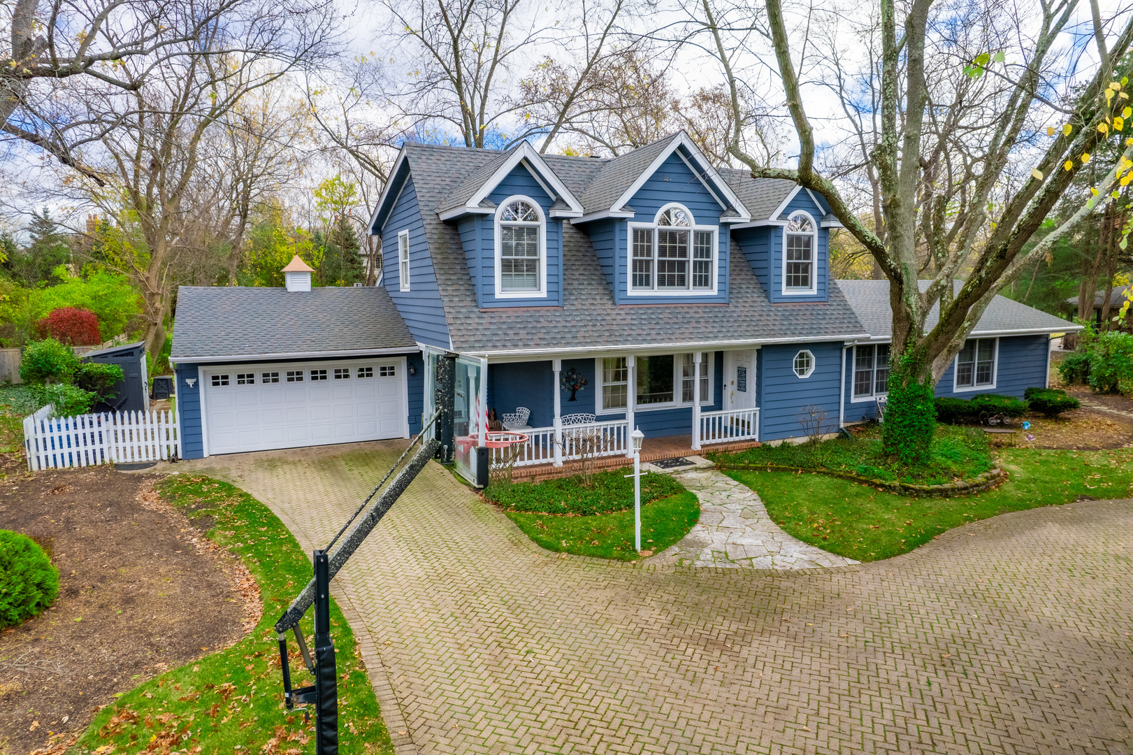 1925 Maple Place Riverwoods, IL 60015 - Photo 52 of 59 a front view of a house with a yard and garage