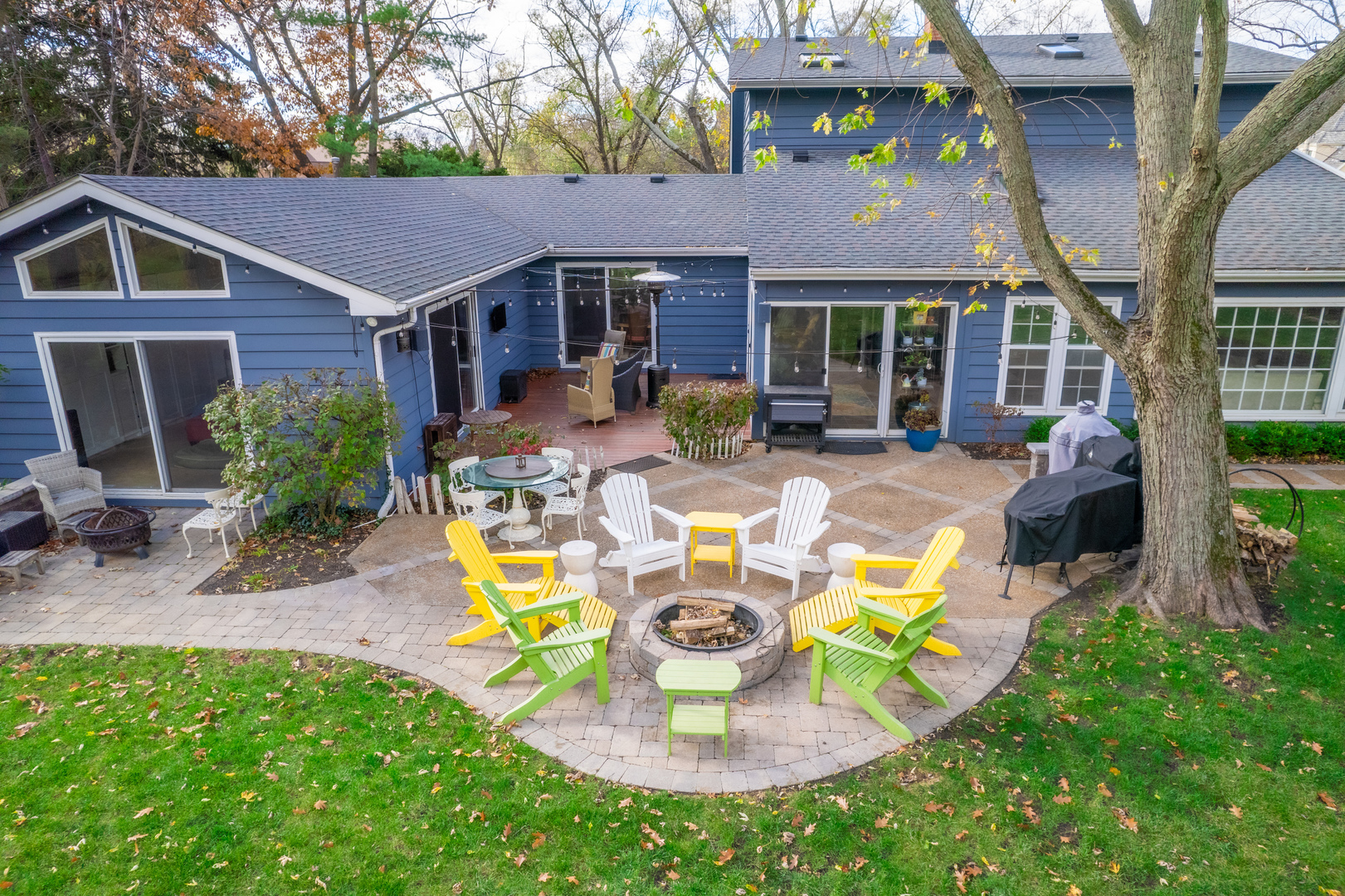 1925 Maple Place Riverwoods, IL 60015 - Photo 54 of 59 a view of a house with a yard patio and fire pit
