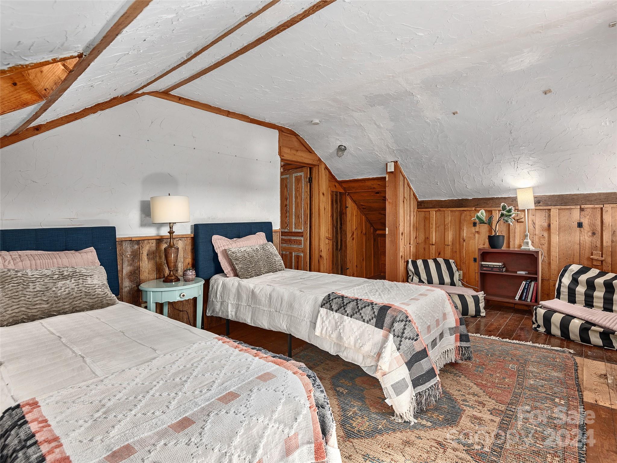 2560 King Road Pisgah Forest, NC 28768 - Photo 15 of 44 a bedroom with two beds and lamp with potted plant