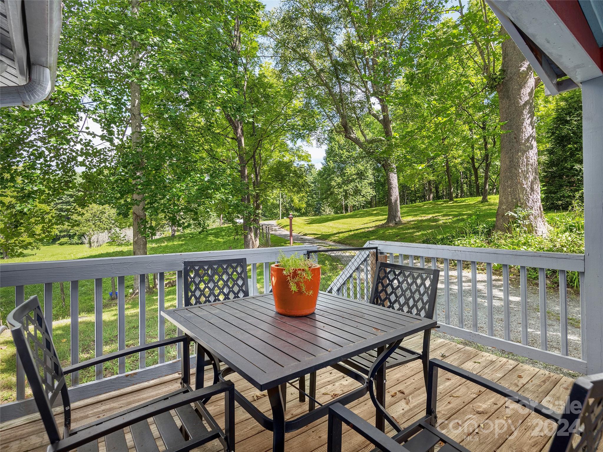 2560 King Road Pisgah Forest, NC 28768 - Photo 18 of 44 a view of a deck with furniture and a backyard